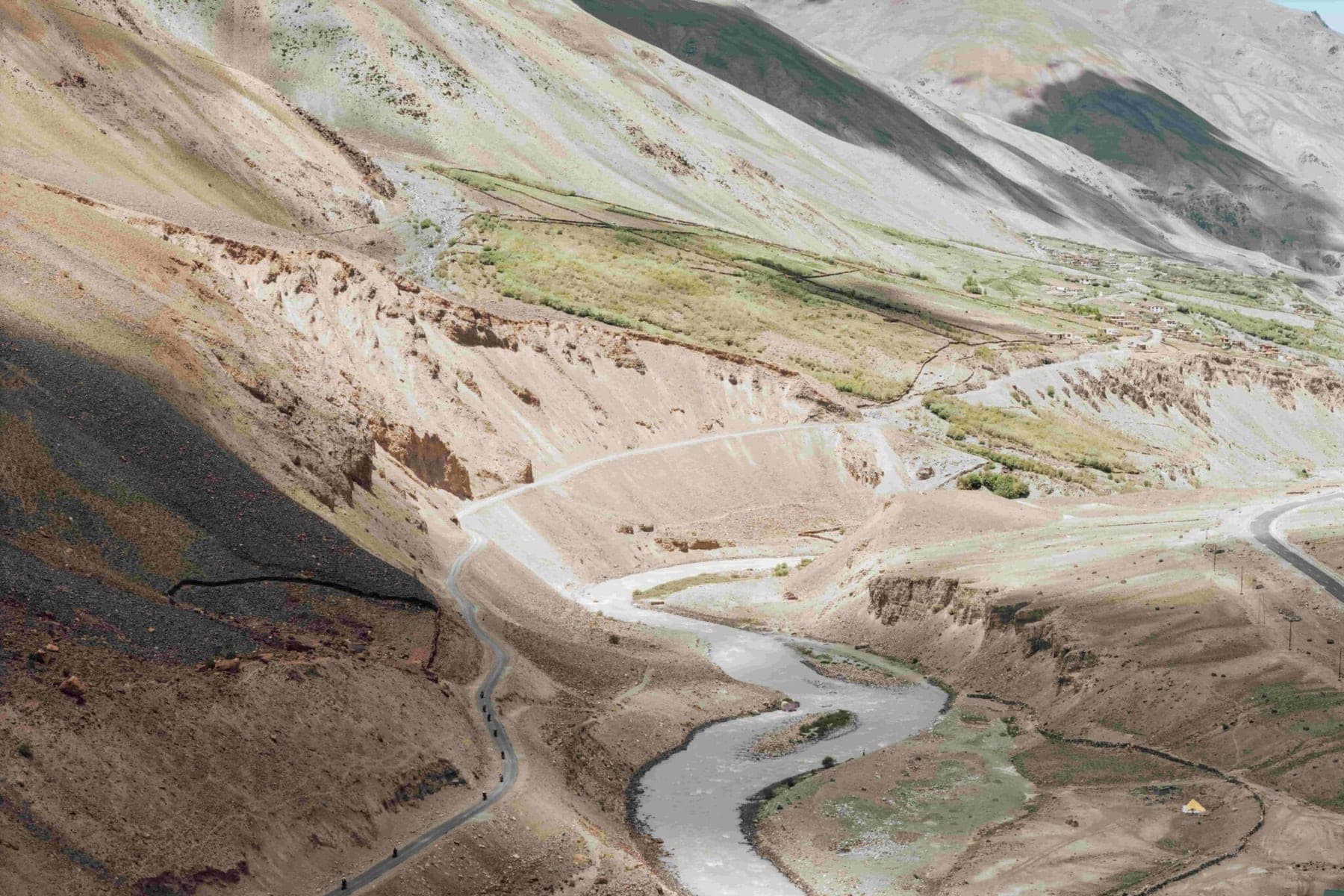 A road following a river valley through the Indian Himalayas