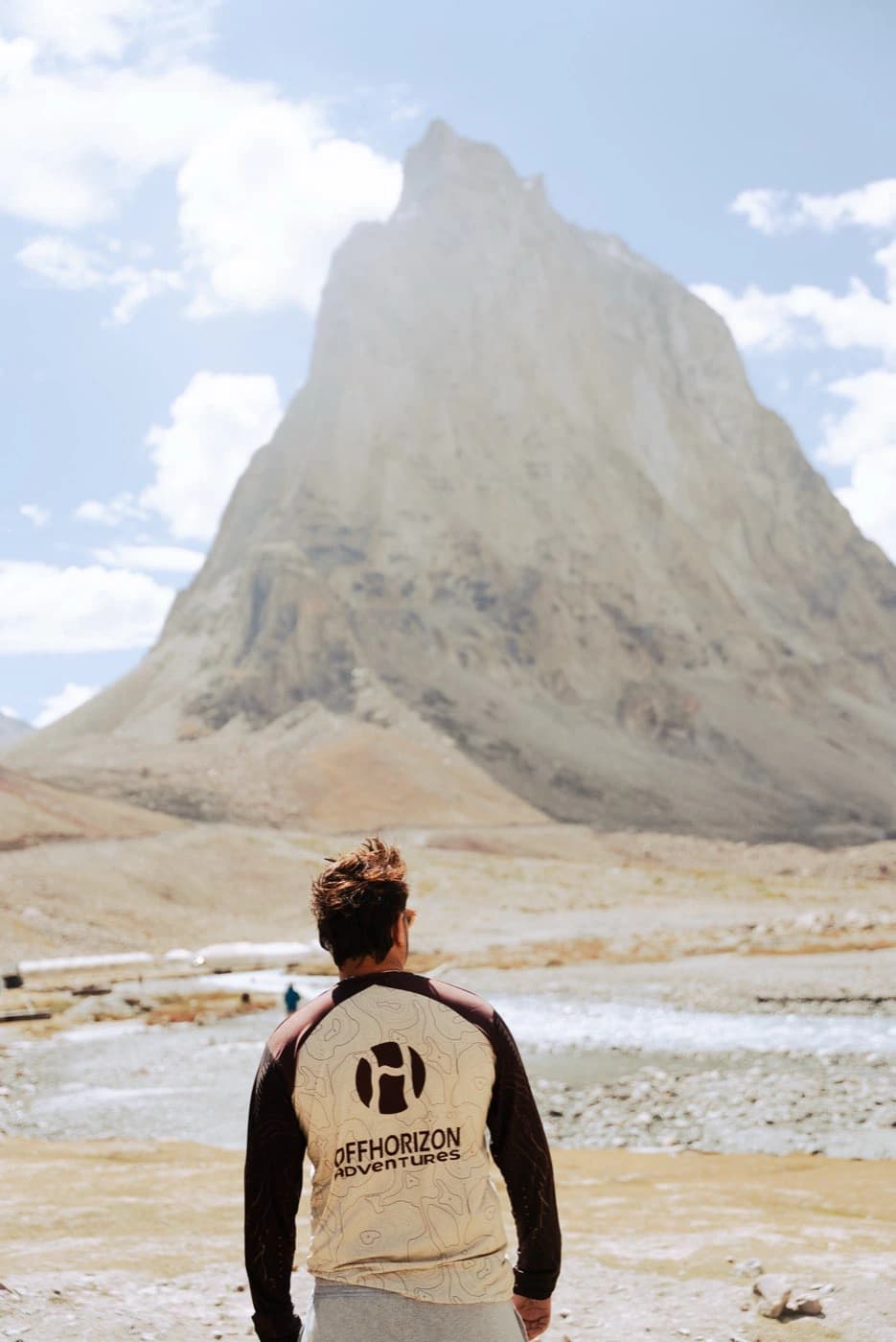 Offhorizon Adventures crew member looking at Gonbo Rangjon across the Lungnak valley