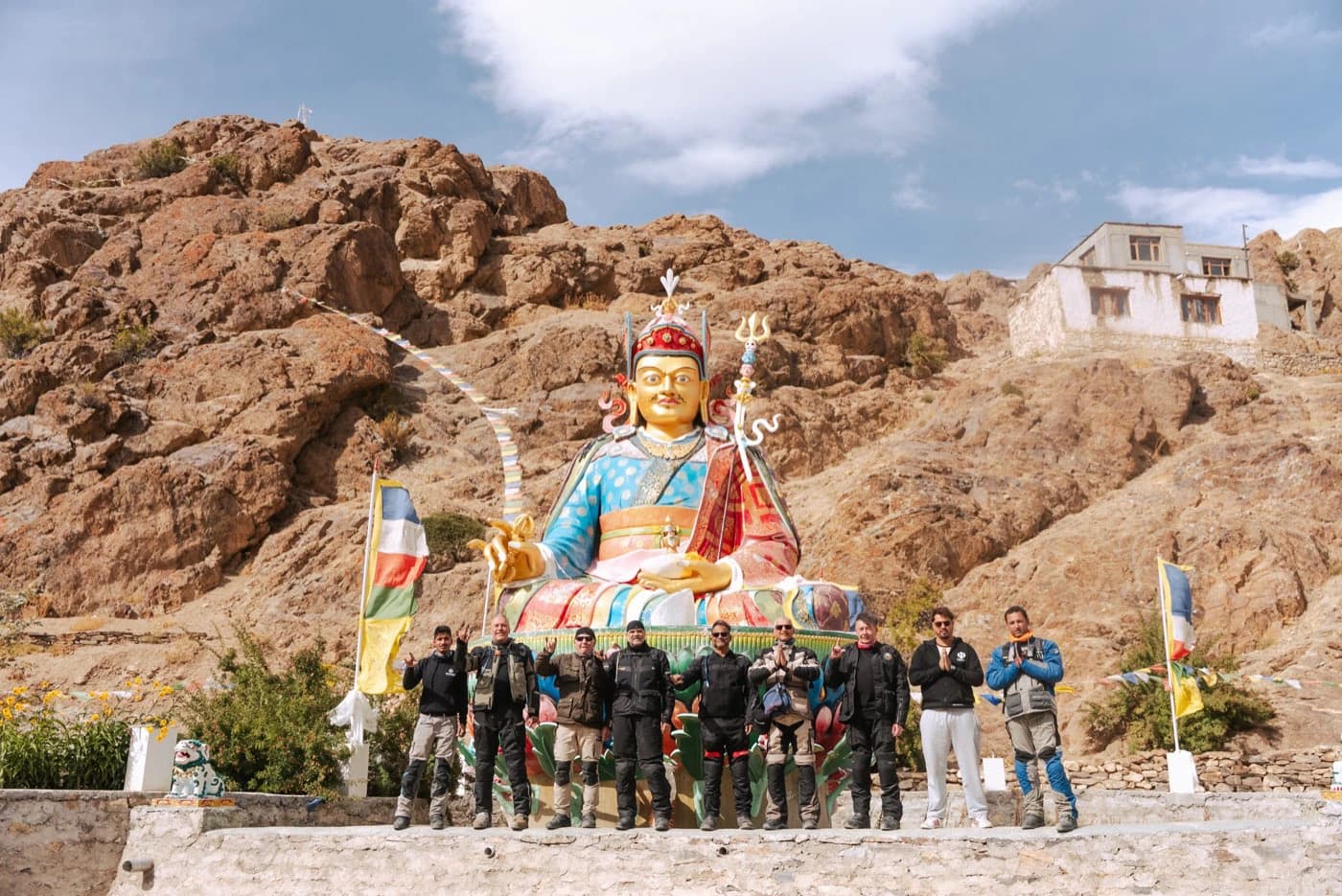 Riders in front of a giant statue of Guru Padmasambhava near Sani, Zanskar