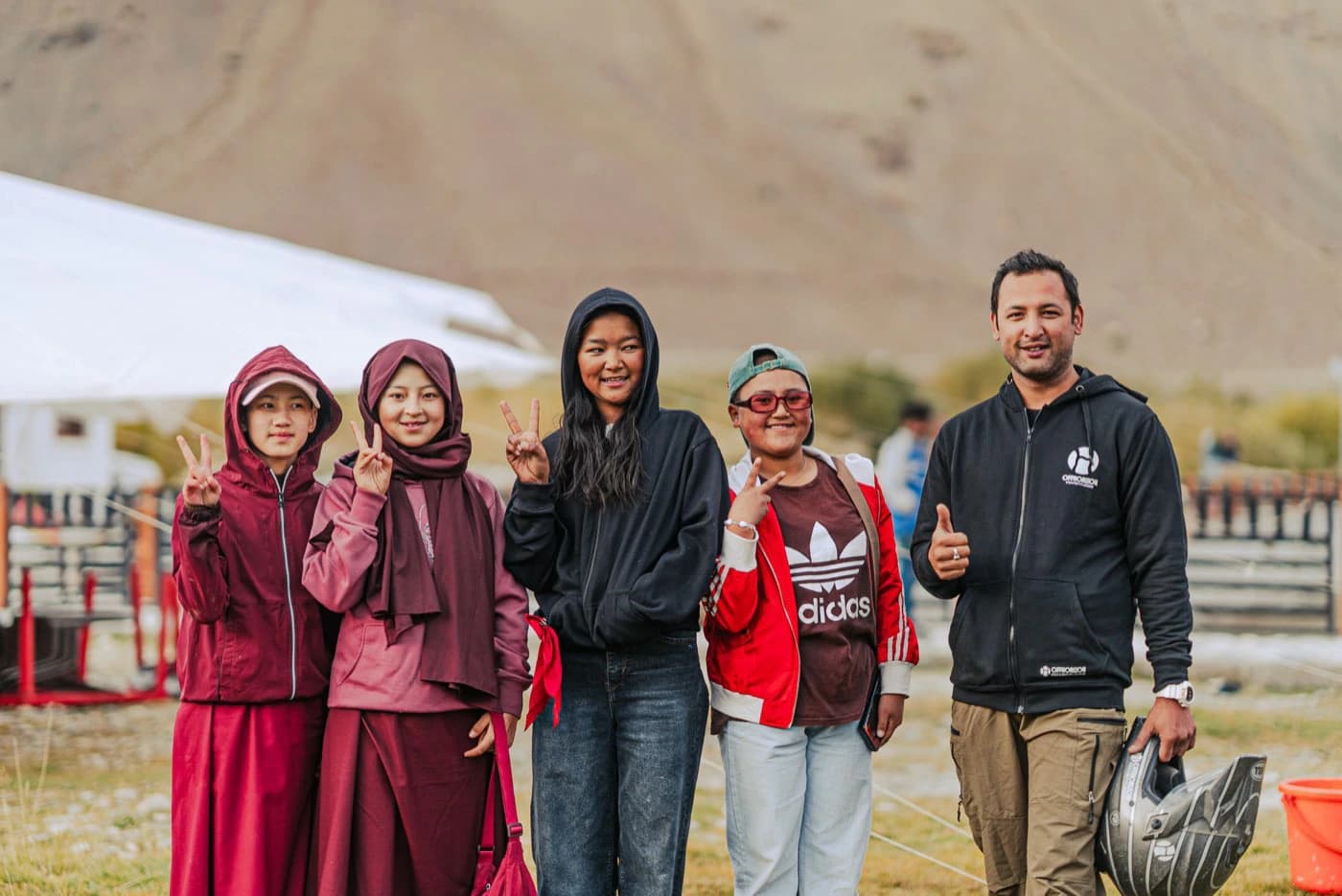 Offhorizon Adventures crew member with young women from Padum at the Zanskar Festival