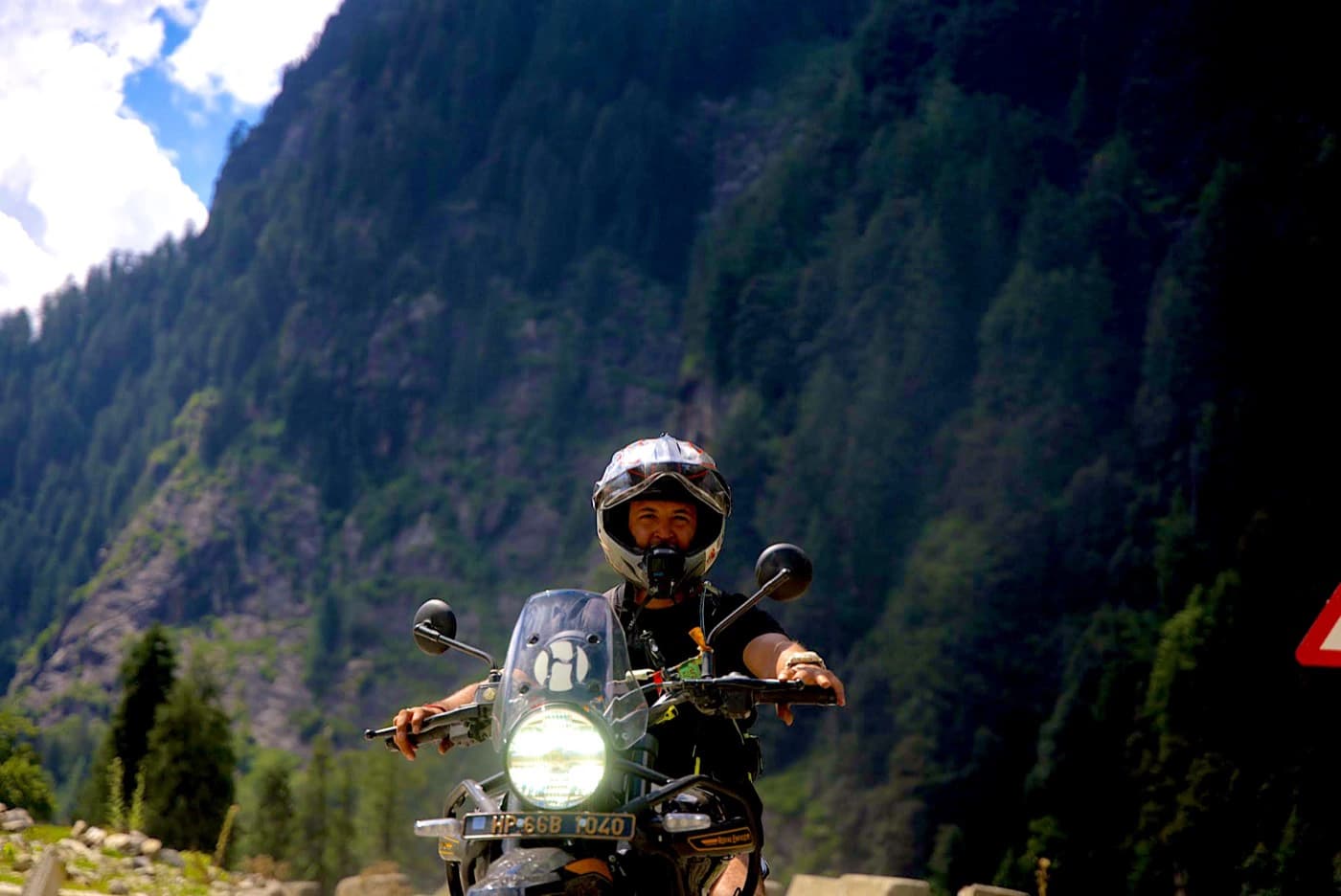 Rider on a Royal Enfield Himalayan 450 on the Hamta road above Manali on Day 2 of the Himalayan motorcycle tour