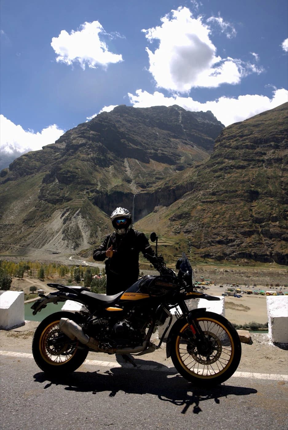 Rider on a Royal Enfield Himalayan 450 beside the Chandra valley in Lahaul
