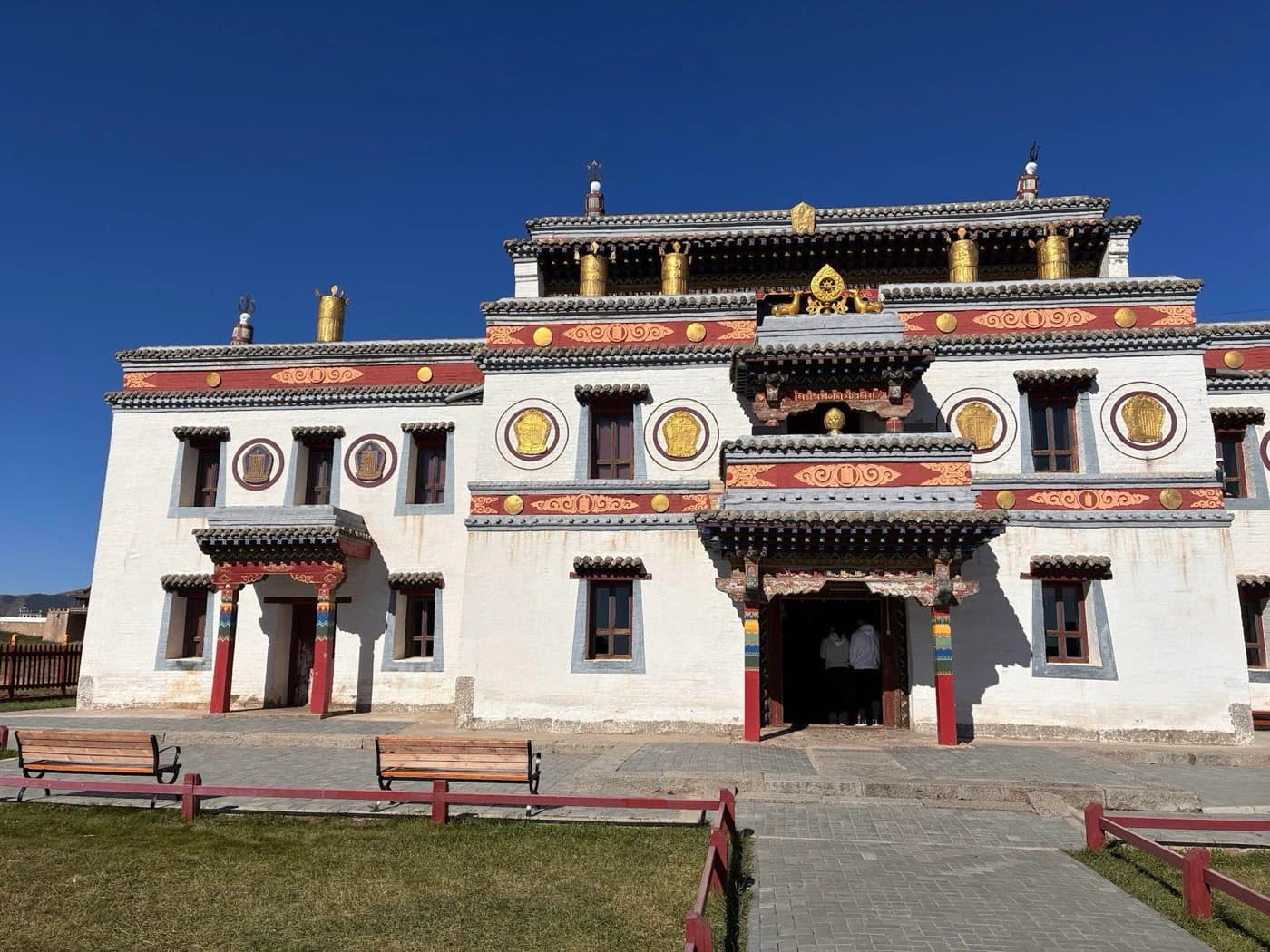 A Buddhist temple building in central Mongolia under a clear sky