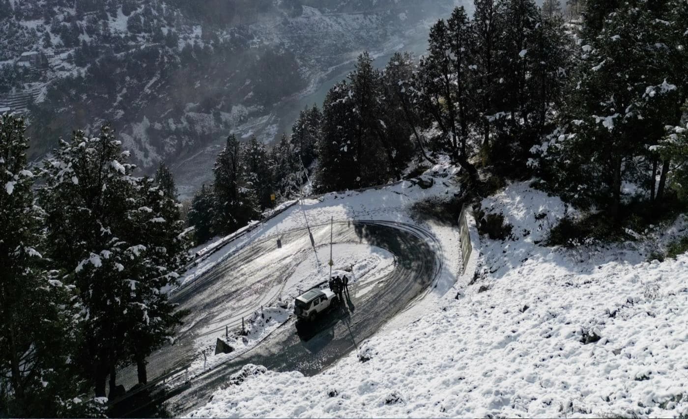 4x4 on a snow covered hairpin road in Kinnaur on the winter route to Spiti