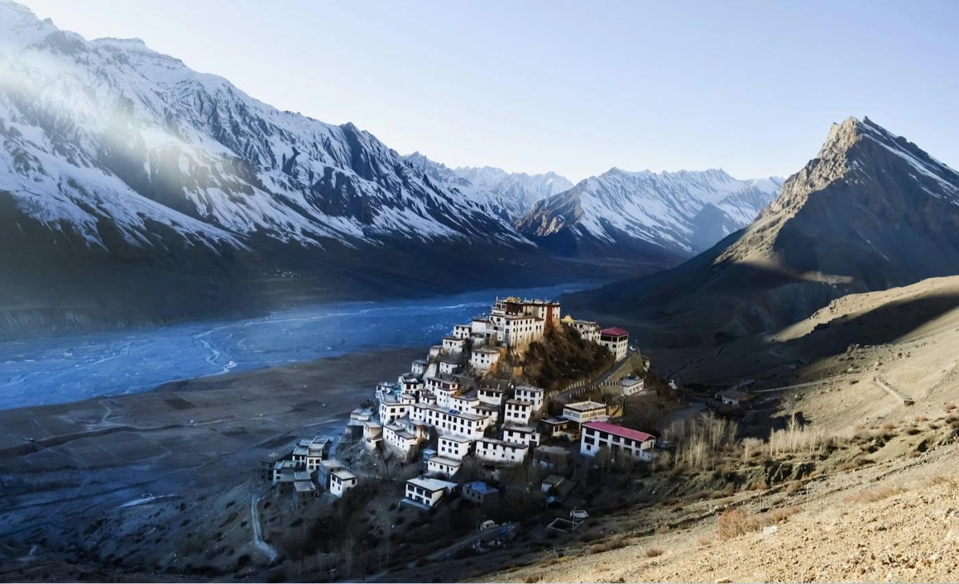 Key Monastery above the Spiti river with snow on the peaks behind