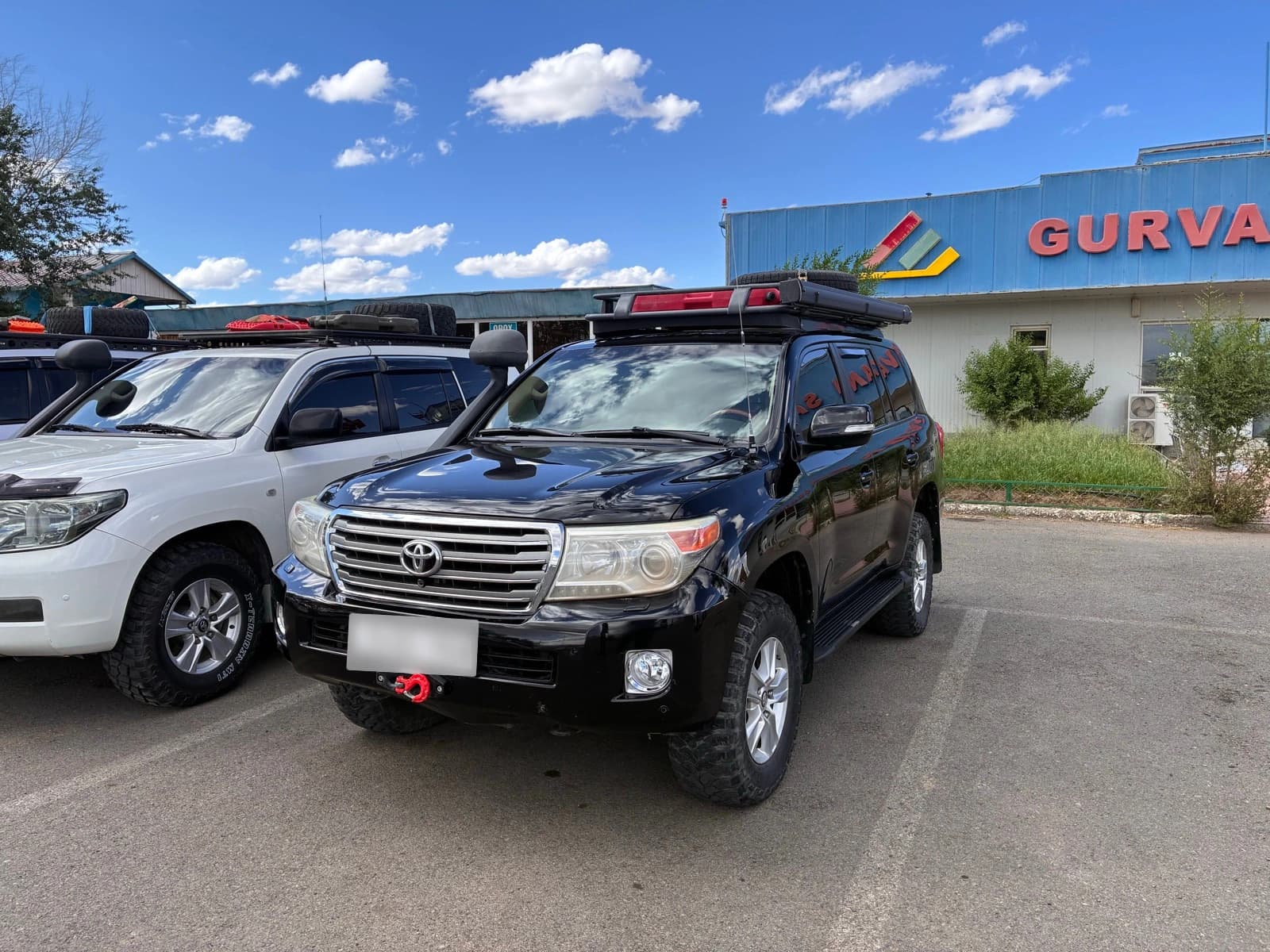 Black Toyota Land Cruiser 200 with roof rack and all-terrain tyres, the vehicle used on the Mongolia 4x4 self-drive expedition