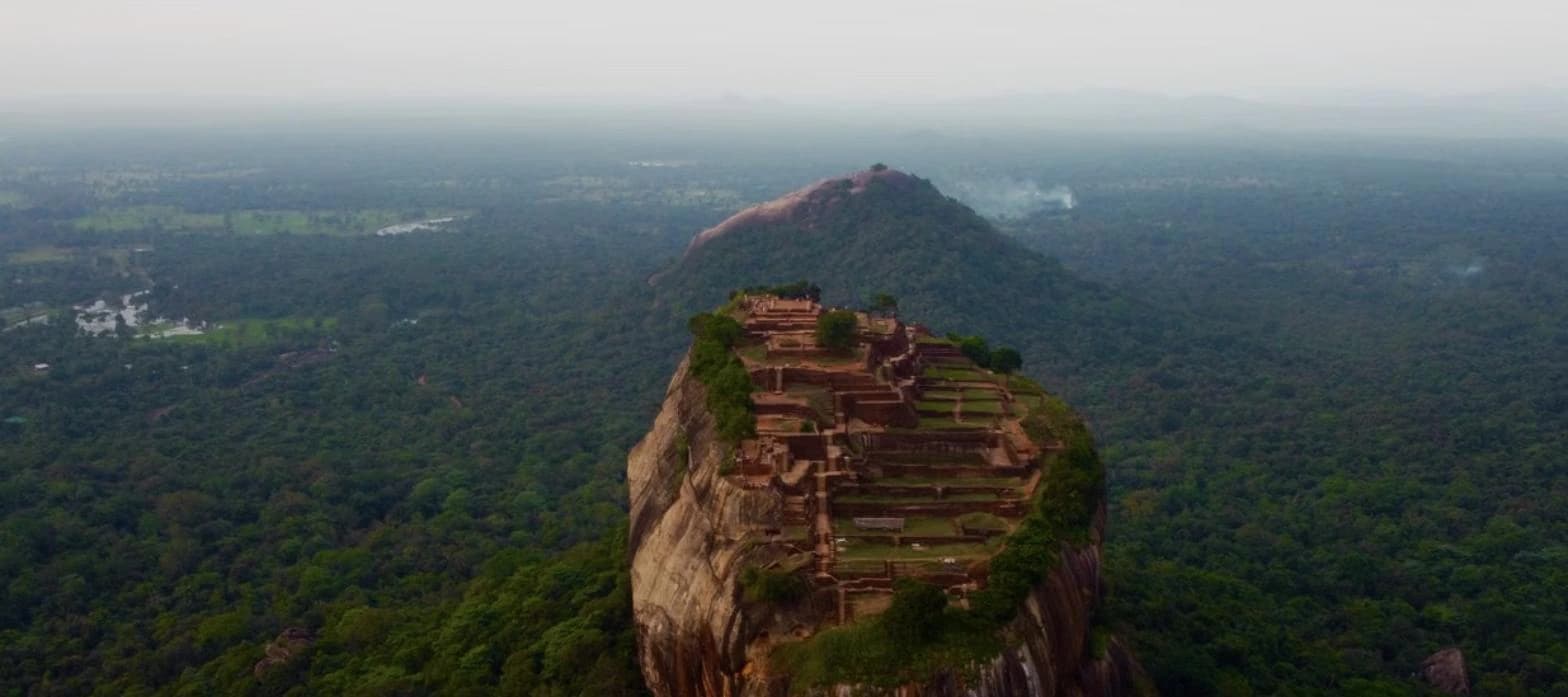 Sigiriya Rock Fortress rising above the jungle in Sri Lanka's Cultural Triangle