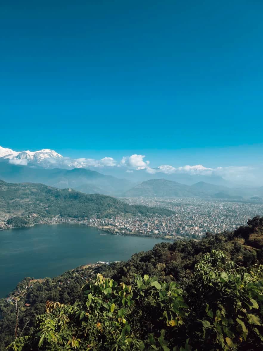 Scenic view of Pokhara city and lake with snow-capped Himalayan mountains in Nepal